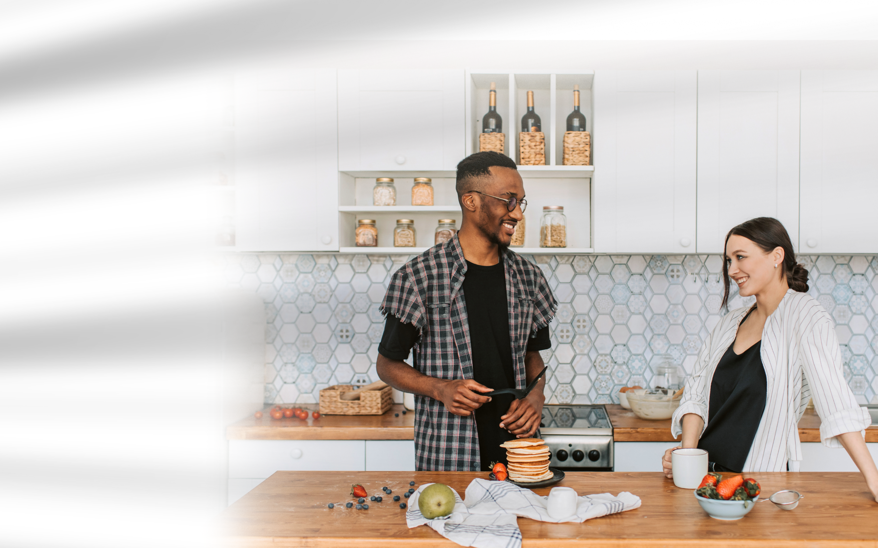 Healthy couple sharing a nutritious breakfast in a clean minimalist kitchen featuring Zenmen bioavailable dietary capsules and science-backed daily wellness supplements.